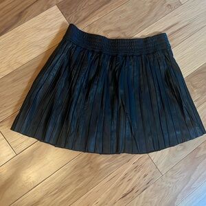 Cute, black, vegan  leather mini skirt. Fully lined